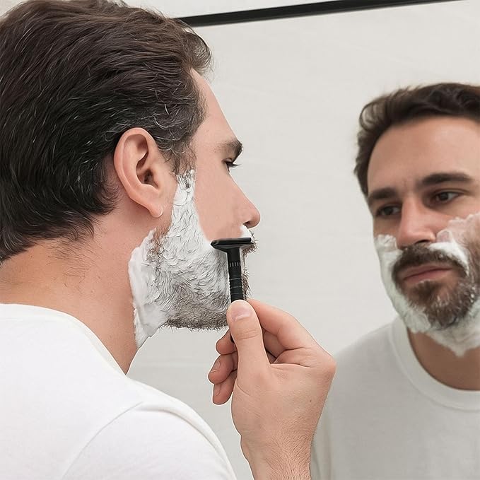 6-speed adjustable dual-blade safety razor with 10 platinum-coated stainless steel blades. Includes optional stand. Comes with complimentary travel pouch. (Black)